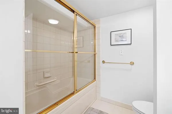 a bathroom with a shower and toilet