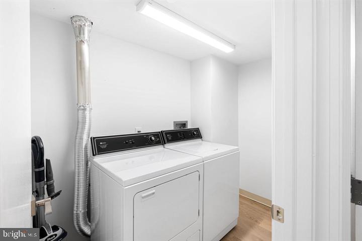 211 South 4th Street, Unit 104 Philadelphia, PA 19106 - Photo 34 of 45 a utility room with dryer and washer