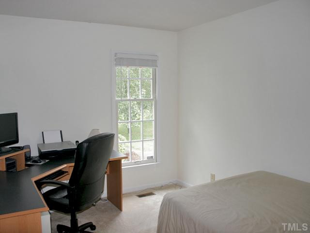 4003 Olde Coach Road Durham, NC 27707 - Photo 9 of 12 a bedroom with a workspace