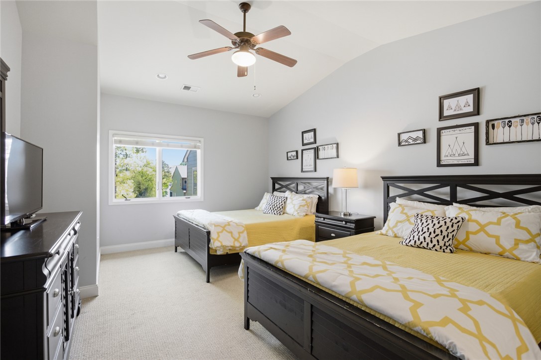 578 Sunset Point Drive West Union, SC 29696 - Photo 16 of 46 This spacious bedroom features ample natural light and a vaulted ceiling.
