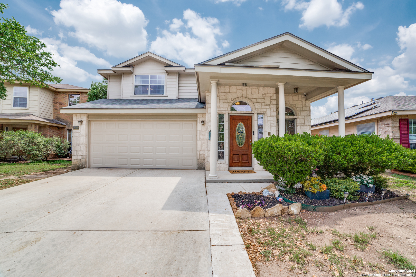 front view of a house with a yard