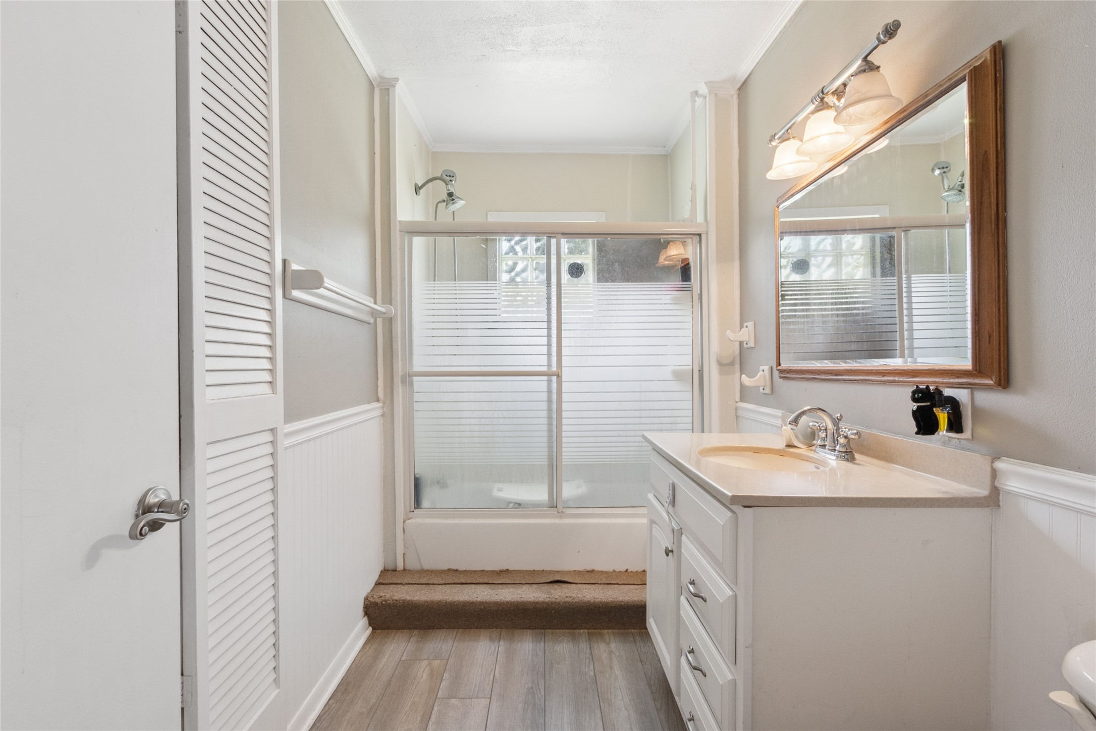 4820 Palmetto Street Bacliff, TX 77518 - Photo 13 of 22 a bathroom with a sink a toilet and shower