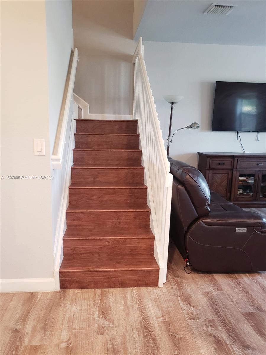 11343 Southwest 232nd Terrace Homestead, FL 33032 - Photo 13 of 35 a living room with furniture and a ceiling fan