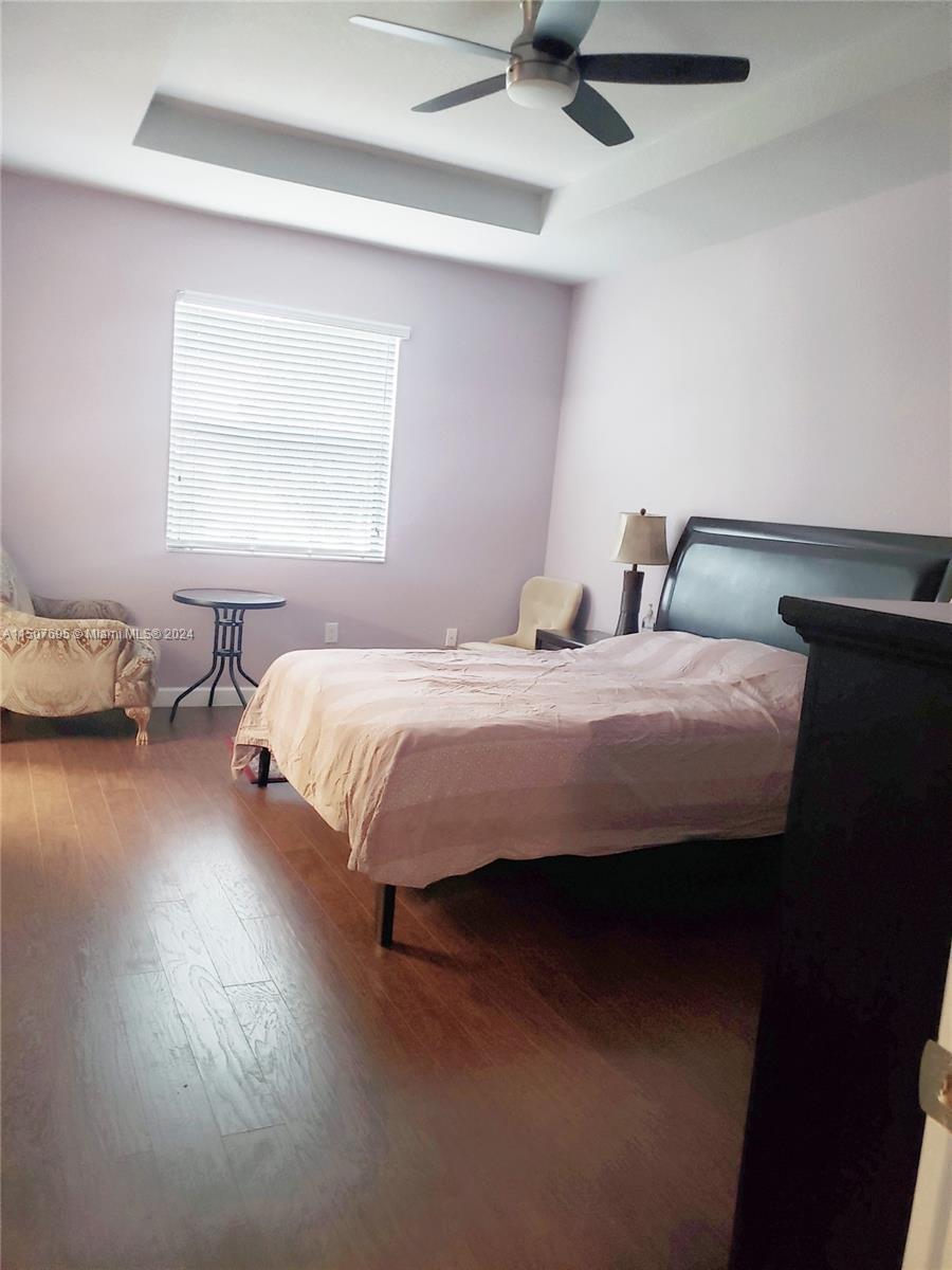 11343 Southwest 232nd Terrace Homestead, FL 33032 - Photo 15 of 35 a bedroom with a bed and window