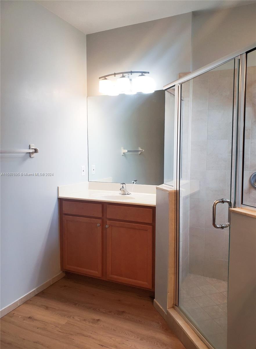 11343 Southwest 232nd Terrace Homestead, FL 33032 - Photo 19 of 35 a bathroom with a double vanity sink mirror and shower