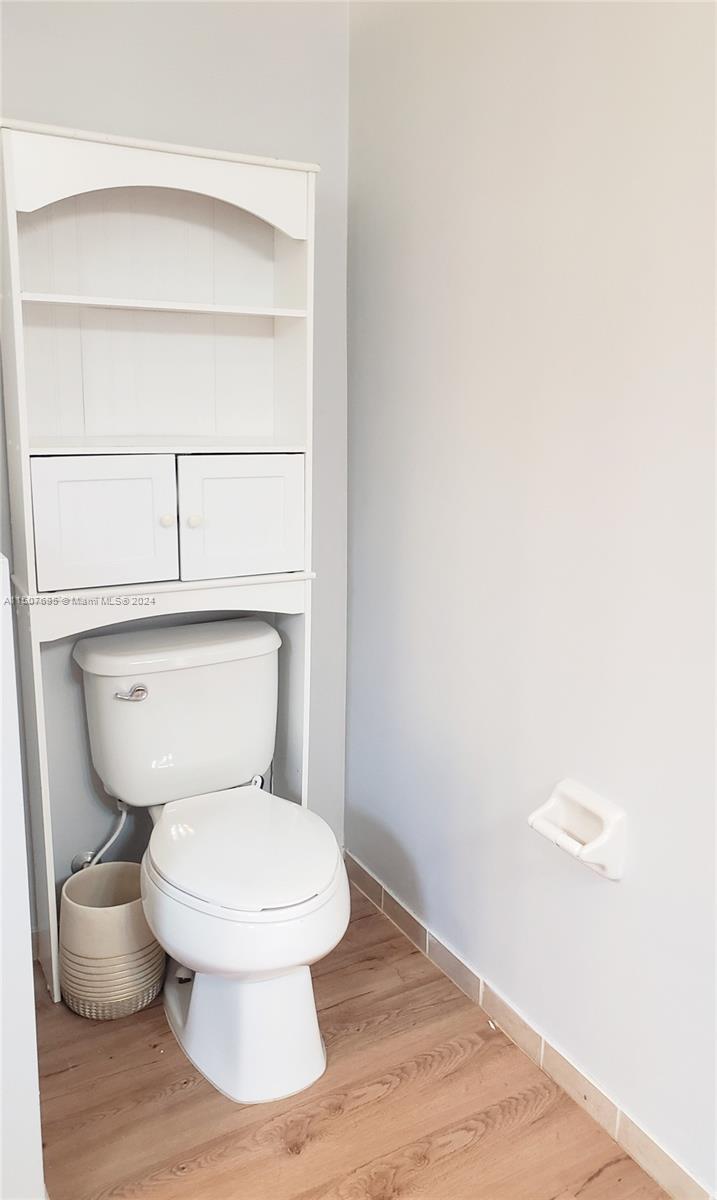 11343 Southwest 232nd Terrace Homestead, FL 33032 - Photo 21 of 35 a white toilet sitting next to a shower