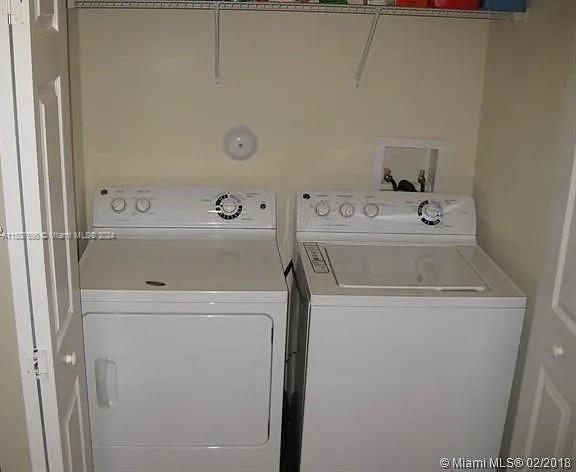11343 Southwest 232nd Terrace Homestead, FL 33032 - Photo 28 of 35 a utility room with dryer and washer