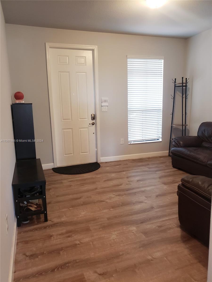 11343 Southwest 232nd Terrace Homestead, FL 33032 - Photo 4 of 35 a view of a livingroom with furniture and a window