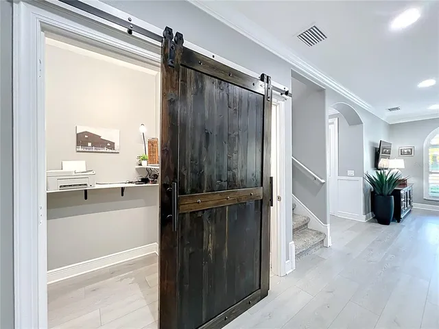 a kitchen with a refrigerator a stove a sink dishwasher with a dining table and chairs