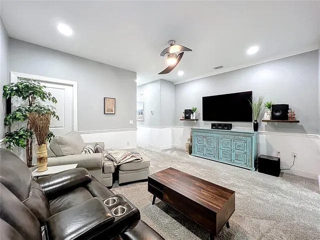 a bathroom with a toilet a sink a mirror a bathtub and shower