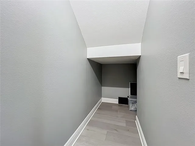 a view of a patio with couches table and chairs and potted plants