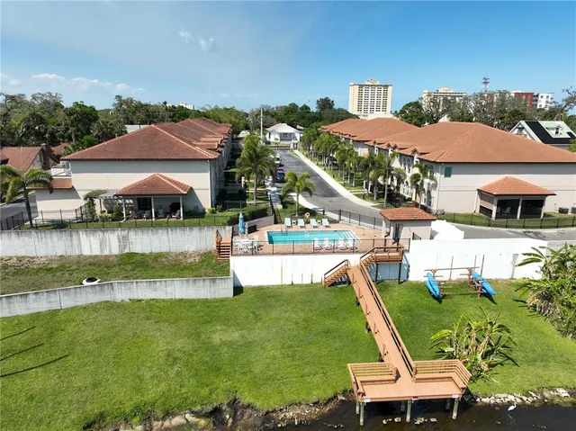 a view of swimming pool with outdoor seating and city view