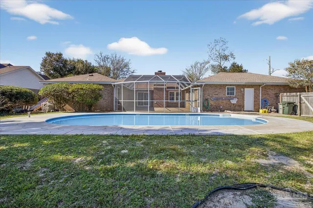 a view of swimming pool with a yard and outdoor seating