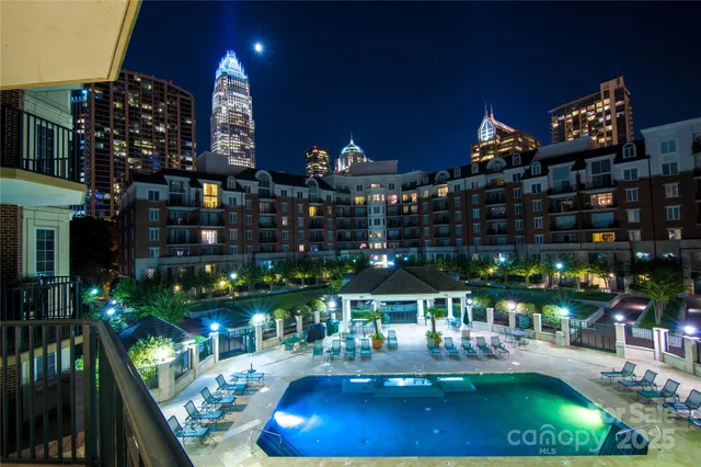 a large white kitchen with a large window