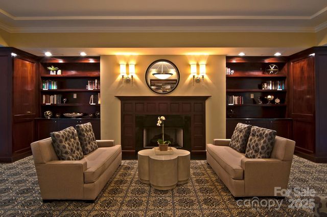 a living room with furniture a lamp and a fireplace