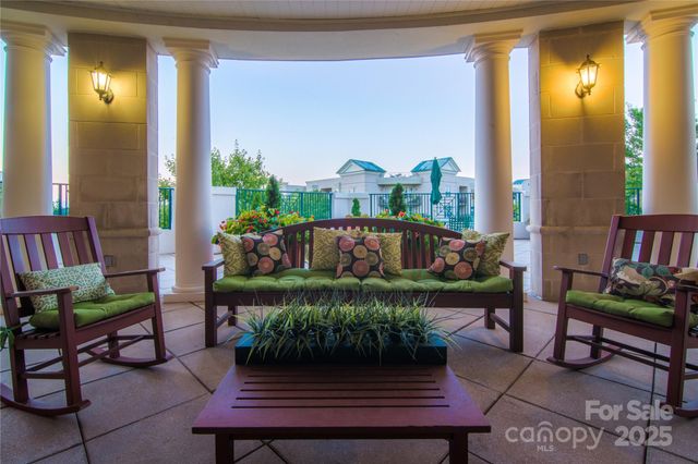 a outdoor living space with furniture and a flat screen tv
