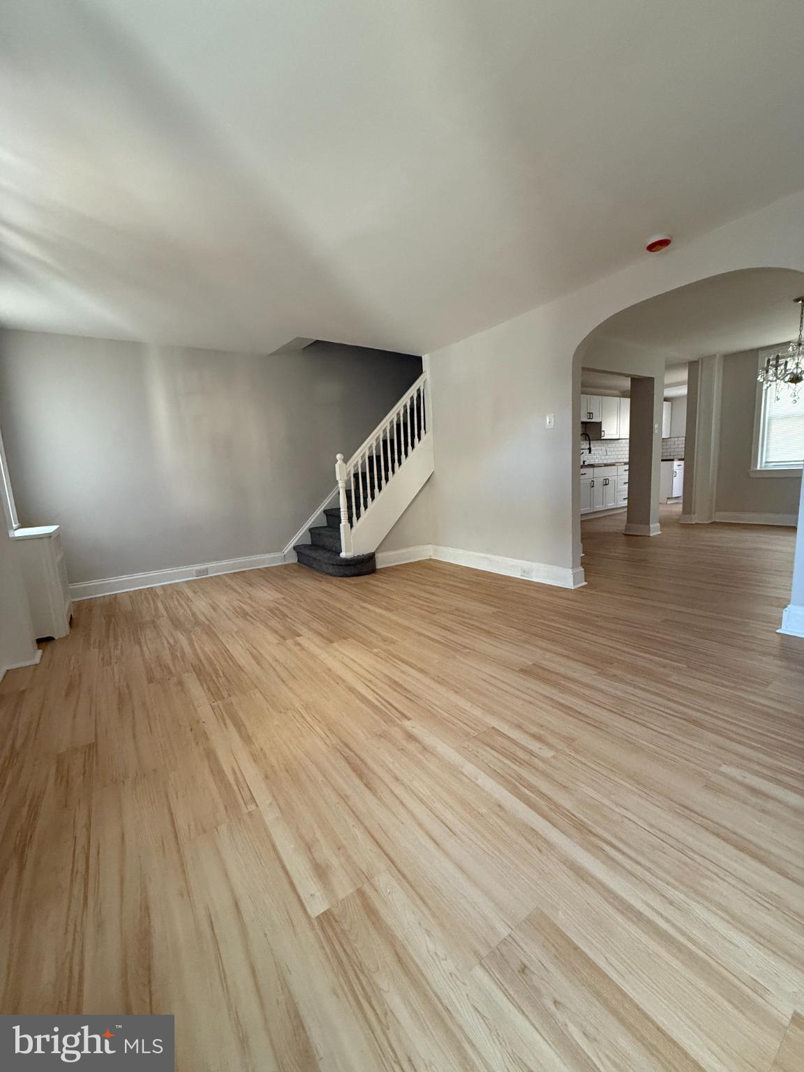 1181 South Octagon Road Camden, NJ 08104 - Photo 3 of 17 a view of an empty room and wooden floor
