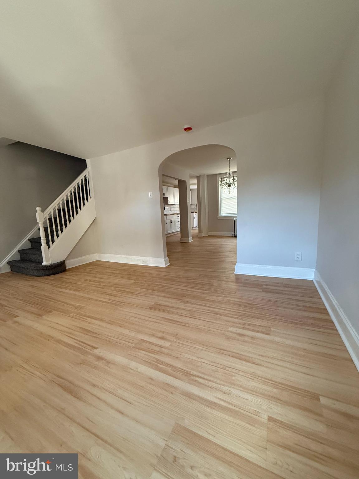 1181 South Octagon Road Camden, NJ 08104 - Photo 4 of 17 a view of an empty room with wooden floor and a window