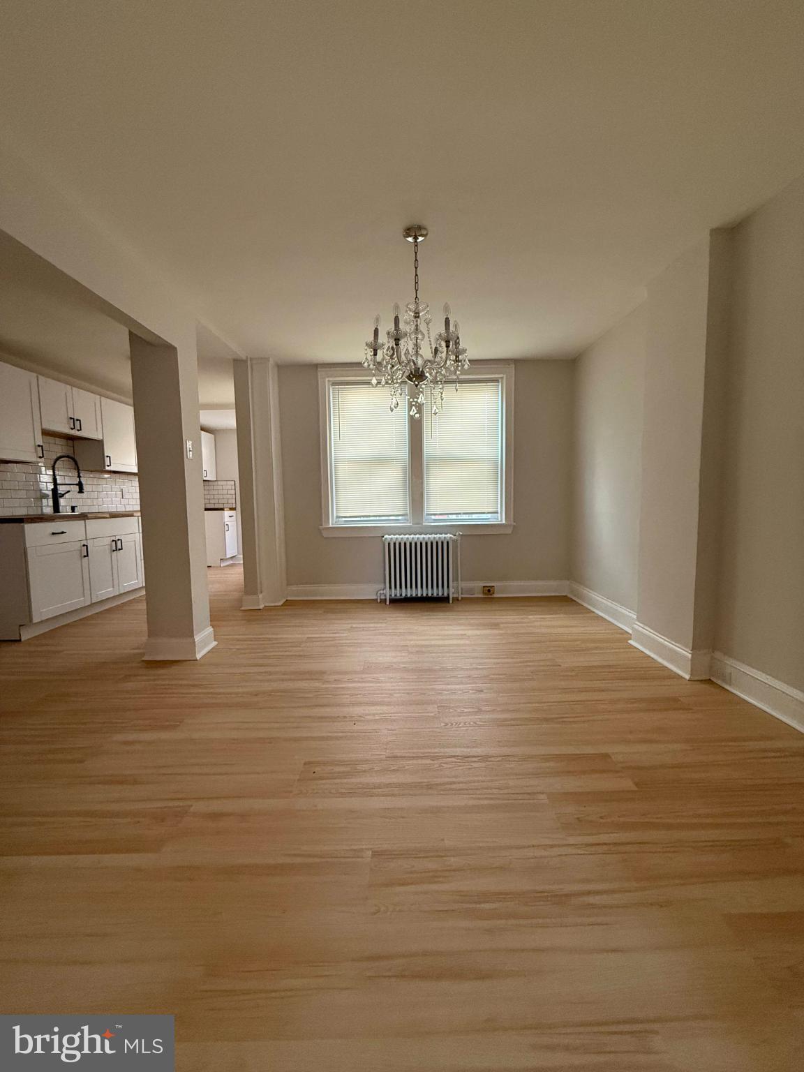 1181 South Octagon Road Camden, NJ 08104 - Photo 6 of 17 a view of empty room with kitchen and window