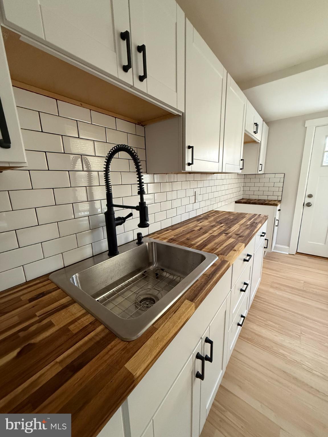 1181 South Octagon Road Camden, NJ 08104 - Photo 7 of 17 a kitchen with a stove and a sink