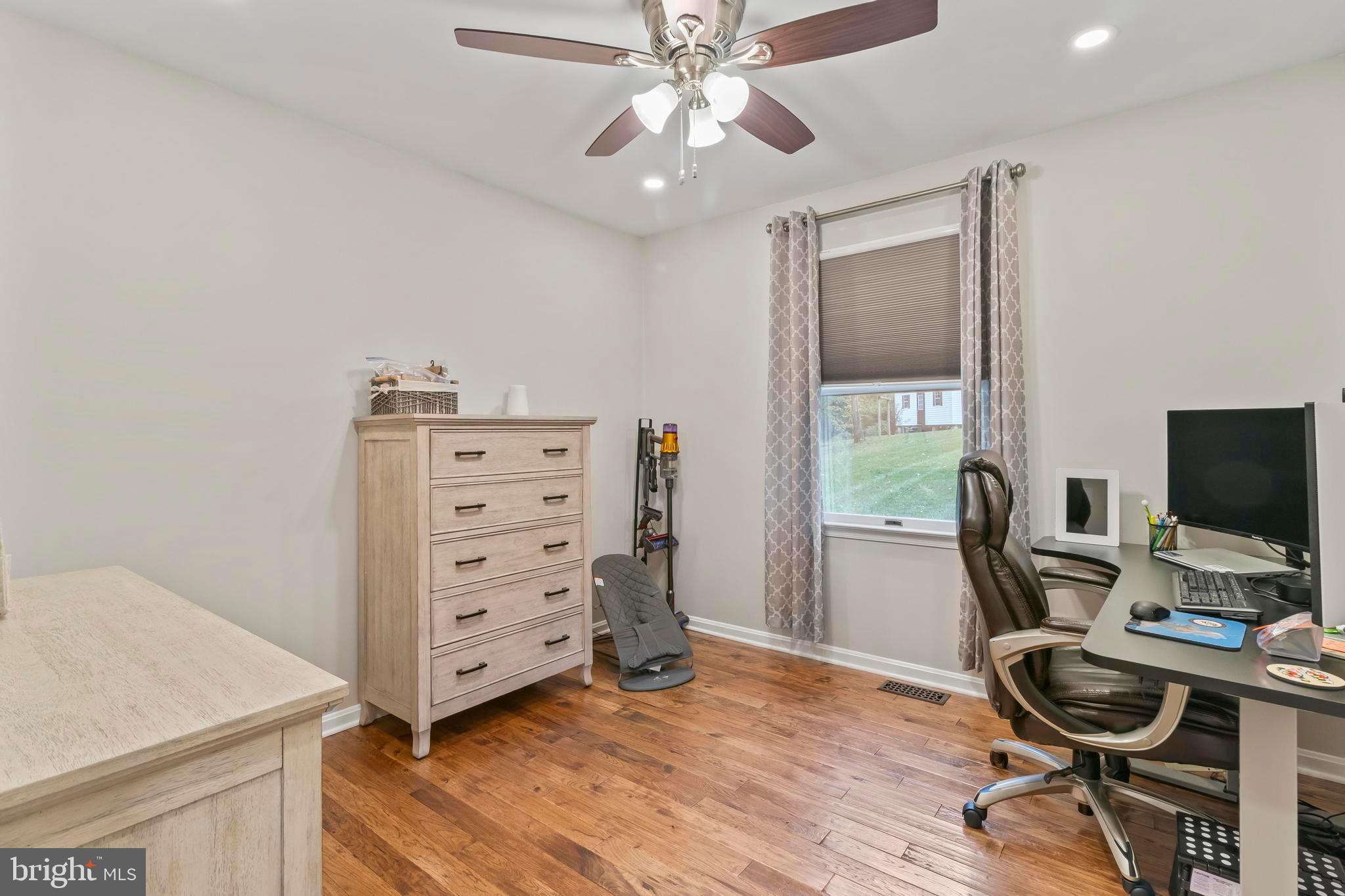 44350 Clarkes Landing Road Hollywood, MD 20636 - Photo 12 of 39 a view of a workspace with furniture and a window
