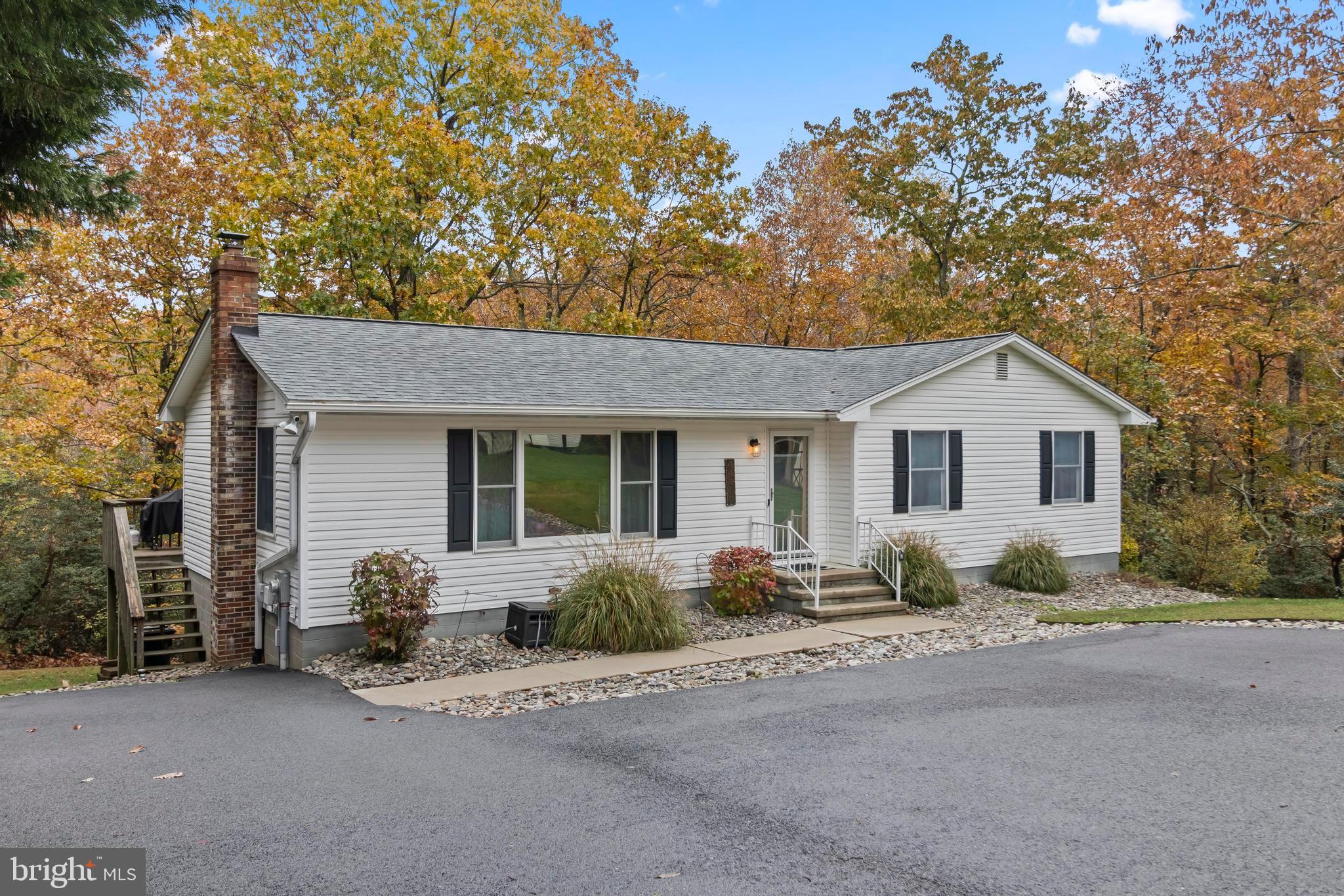 44350 Clarkes Landing Road Hollywood, MD 20636 - Photo 28 of 39 a front view of a house with a yard and garage