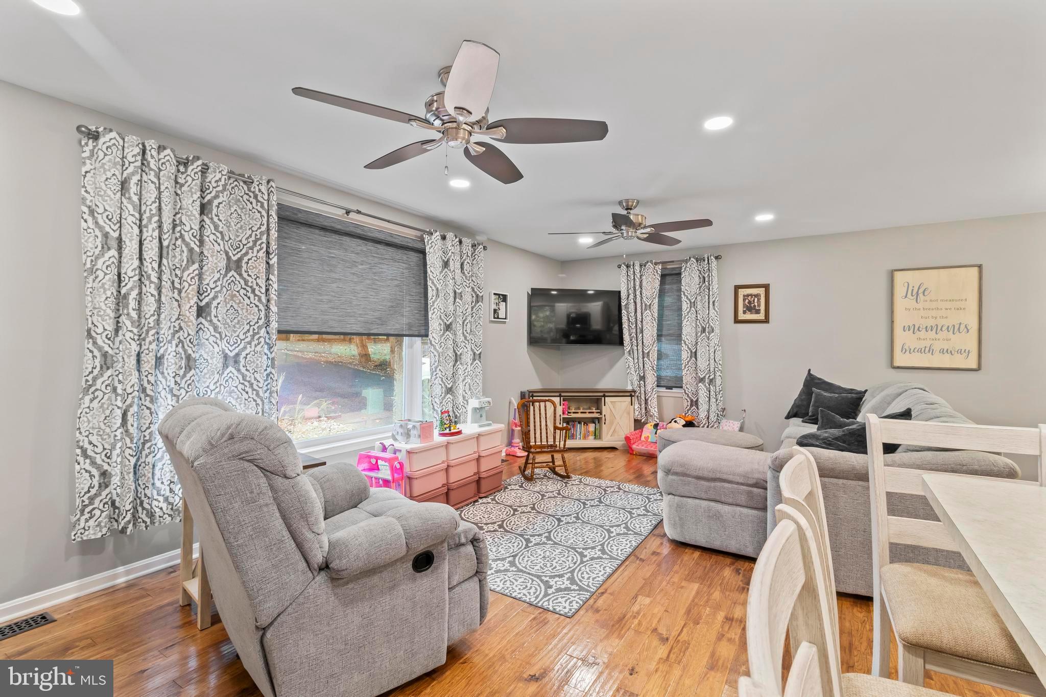 44350 Clarkes Landing Road Hollywood, MD 20636 - Photo 3 of 39 a living room with furniture and a flat screen tv