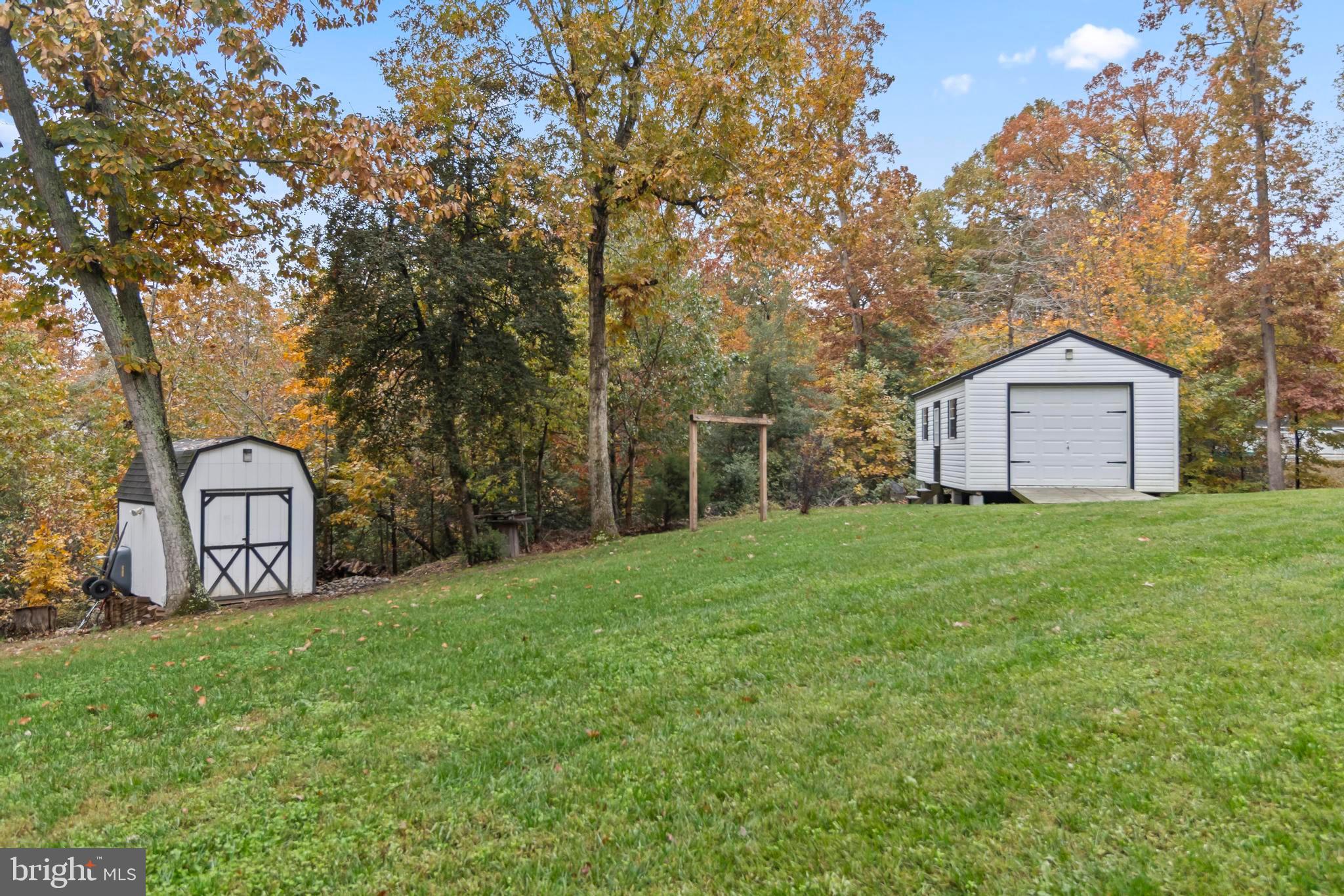 44350 Clarkes Landing Road Hollywood, MD 20636 - Photo 32 of 39 a front view of a house with garden