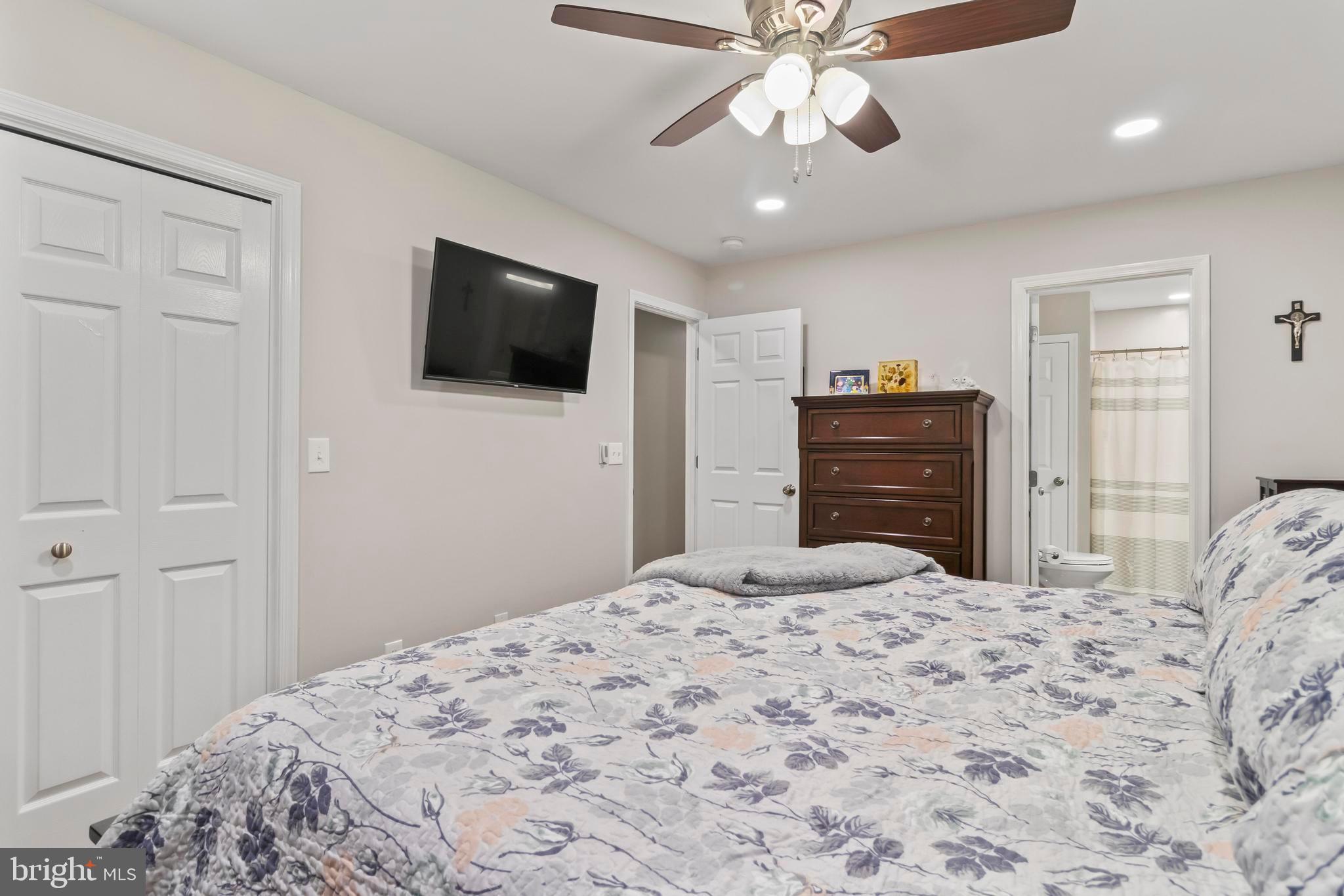 44350 Clarkes Landing Road Hollywood, MD 20636 - Photo 38 of 39 a bedroom with a bed and a flat screen tv