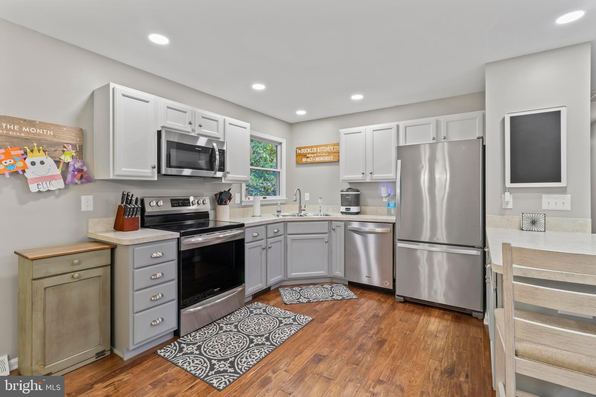 44350 Clarkes Landing Road Hollywood, MD 20636 - Photo 6 of 39 a kitchen with a refrigerator stove and microwave