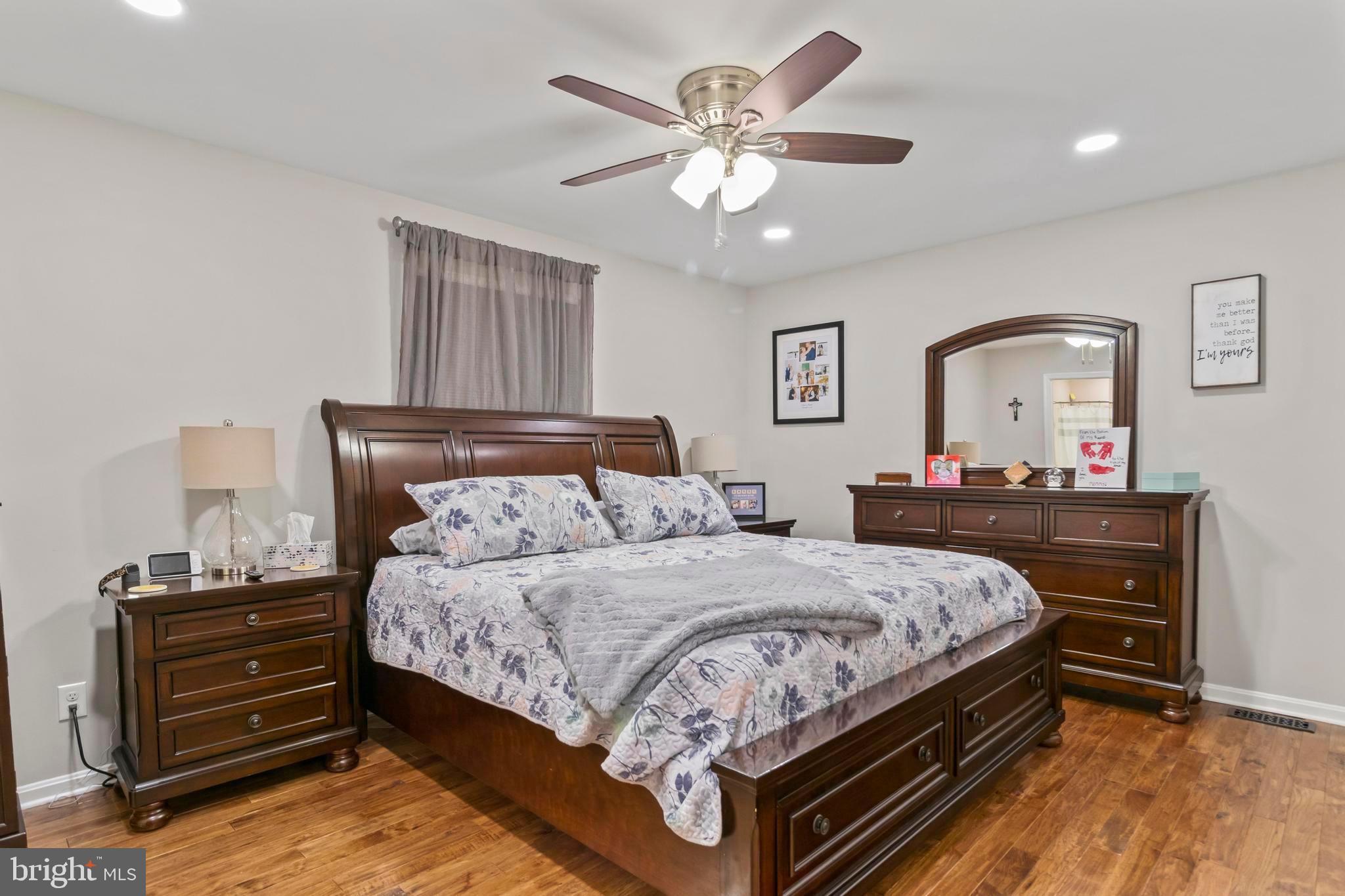 44350 Clarkes Landing Road Hollywood, MD 20636 - Photo 7 of 39 a bedroom with a bed and a dresser