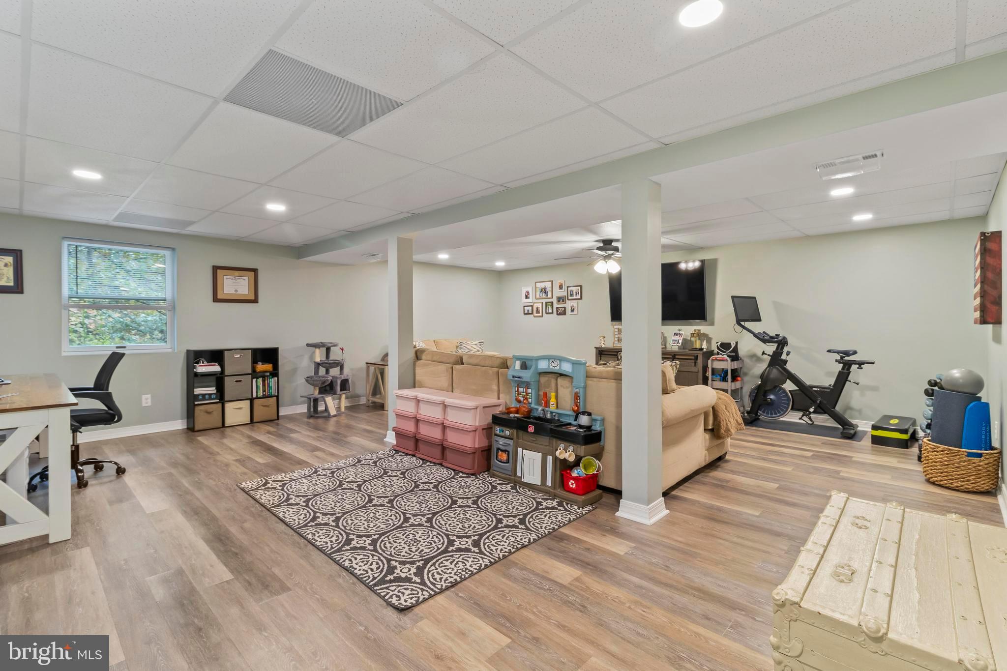 44350 Clarkes Landing Road Hollywood, MD 20636 - Photo 9 of 39 a living room with furniture and a table