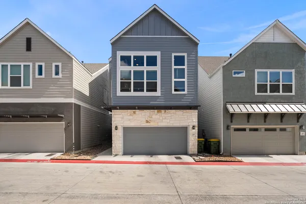 a front view of a house with yard