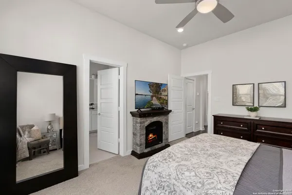 a bedroom with a bed and a dresser