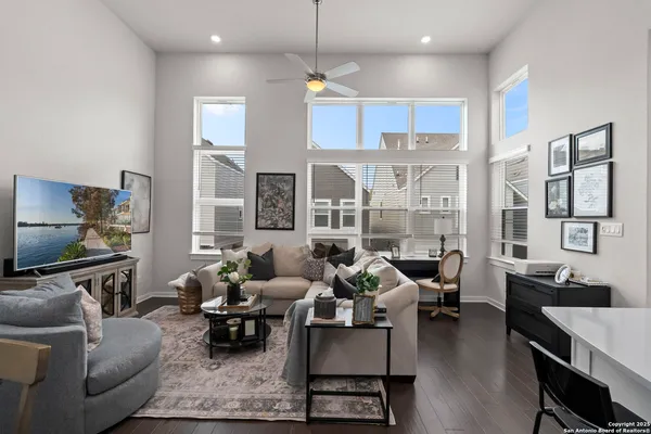 a living room with fireplace furniture and a flat screen tv