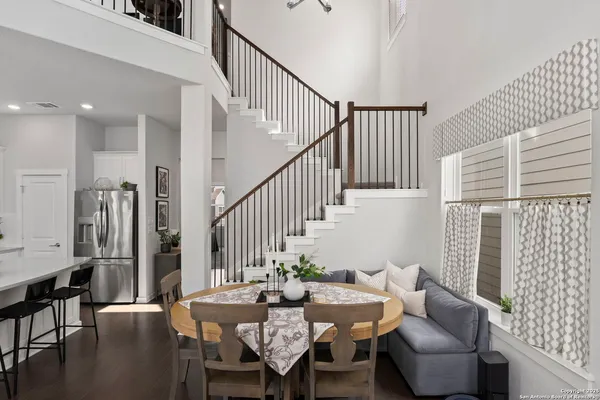 a view of a livingroom with furniture and floor to ceiling window