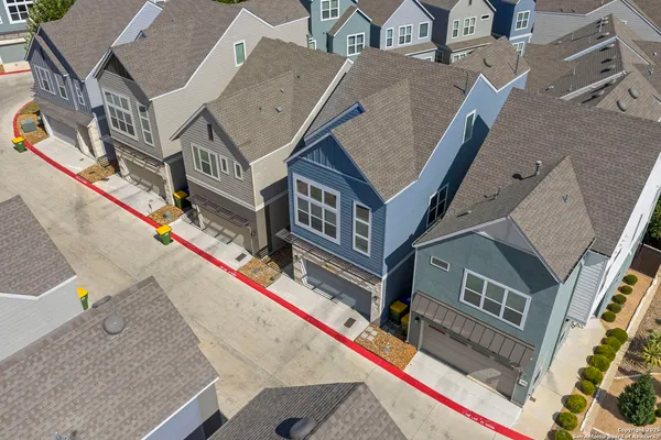 an aerial view of a residential apartment building with a swimming pool