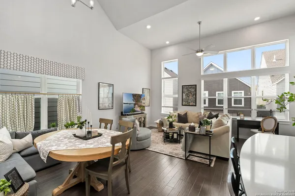 a view of a dining room with furniture window and wooden floor