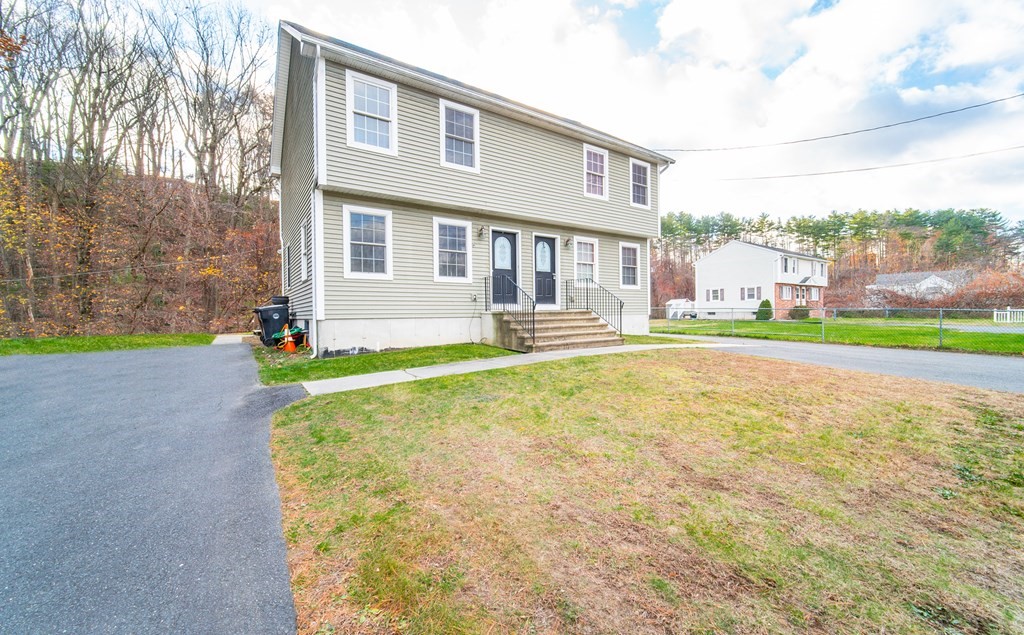 592 Russell Road Westfield, MA 01085 - Photo 2 of 32 a front view of a house with a yard