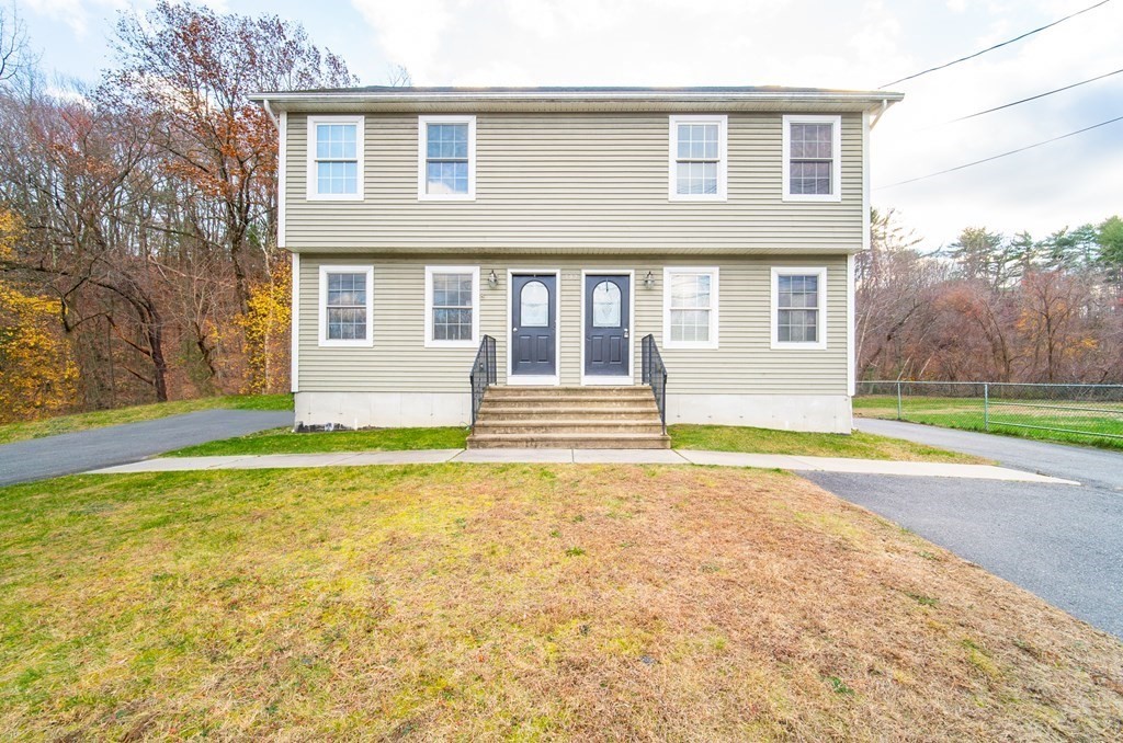 592 Russell Road Westfield, MA 01085 - Photo 3 of 32 a front view of a house with a yard