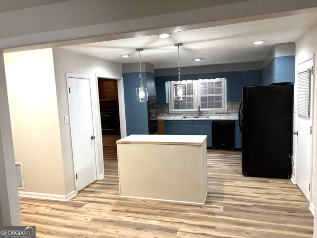 a view of fireplace and wooden floor