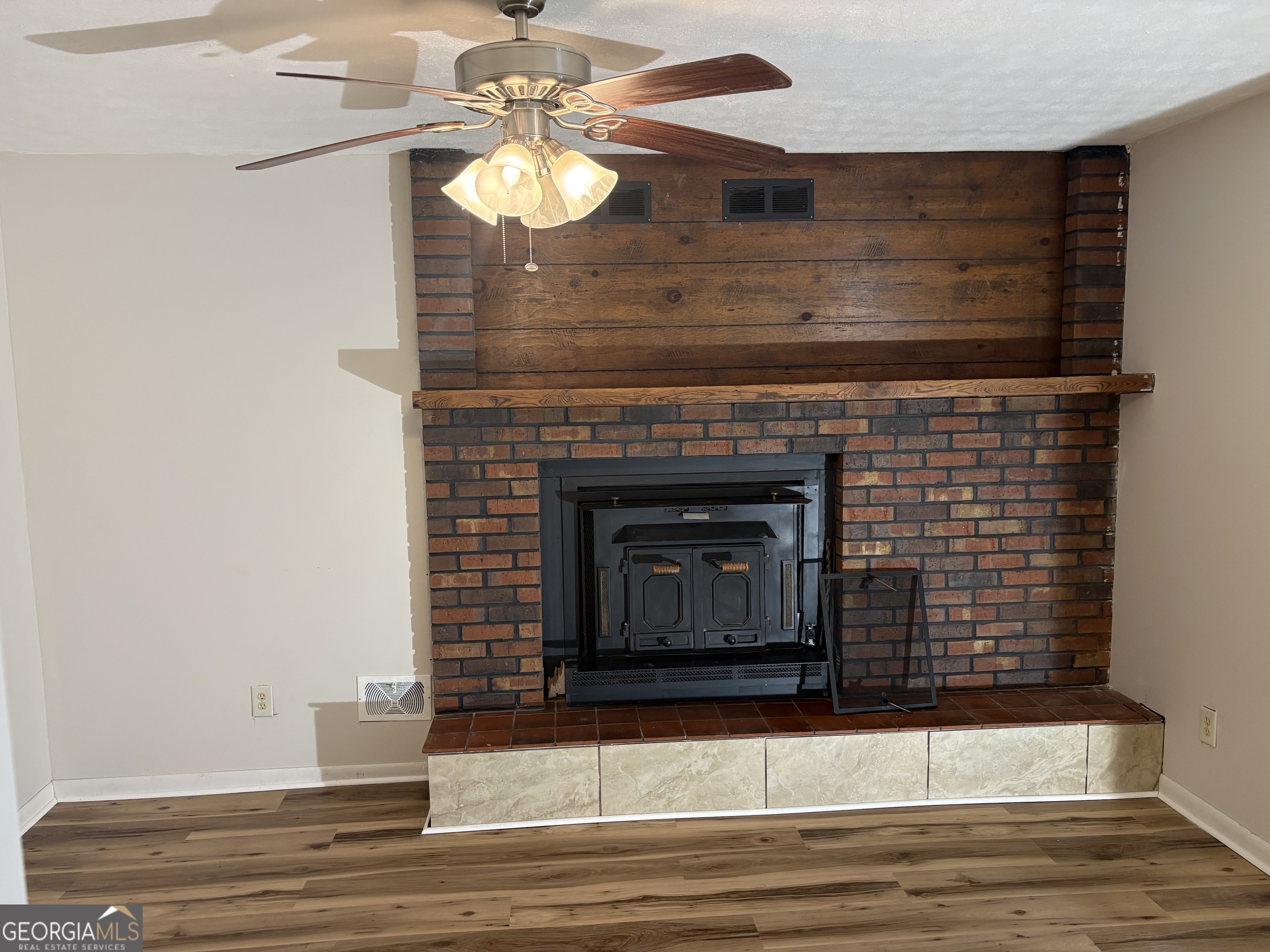 111 Hawthorne Road Warner Robins, GA 31093 - Photo 13 of 22 a view of fireplace and wooden floor