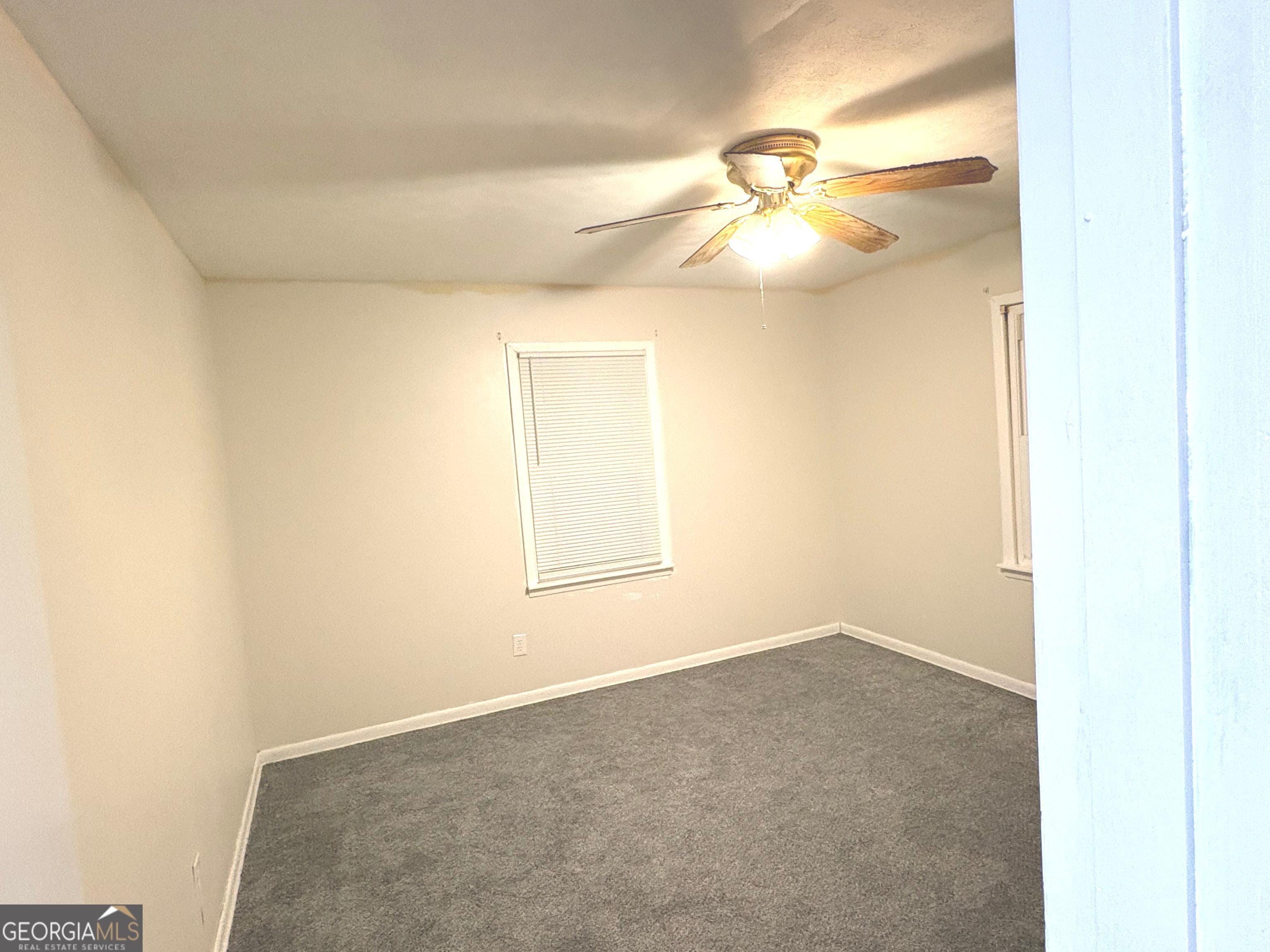 111 Hawthorne Road Warner Robins, GA 31093 - Photo 19 of 22 an empty room with a window and wooden floor