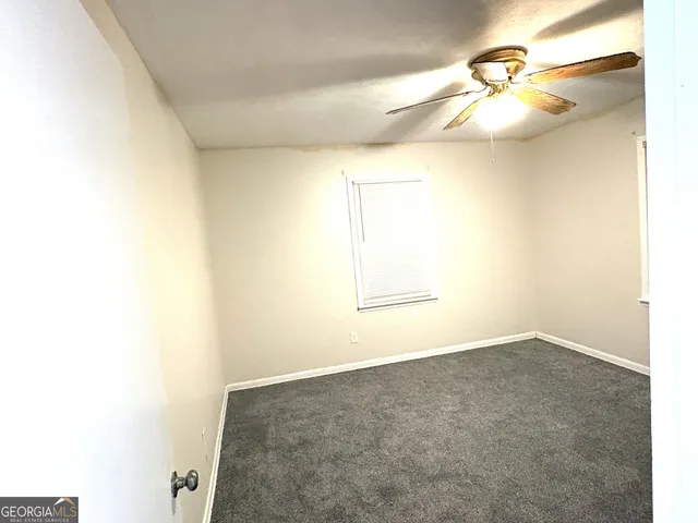 a view of a small space with wooden floor