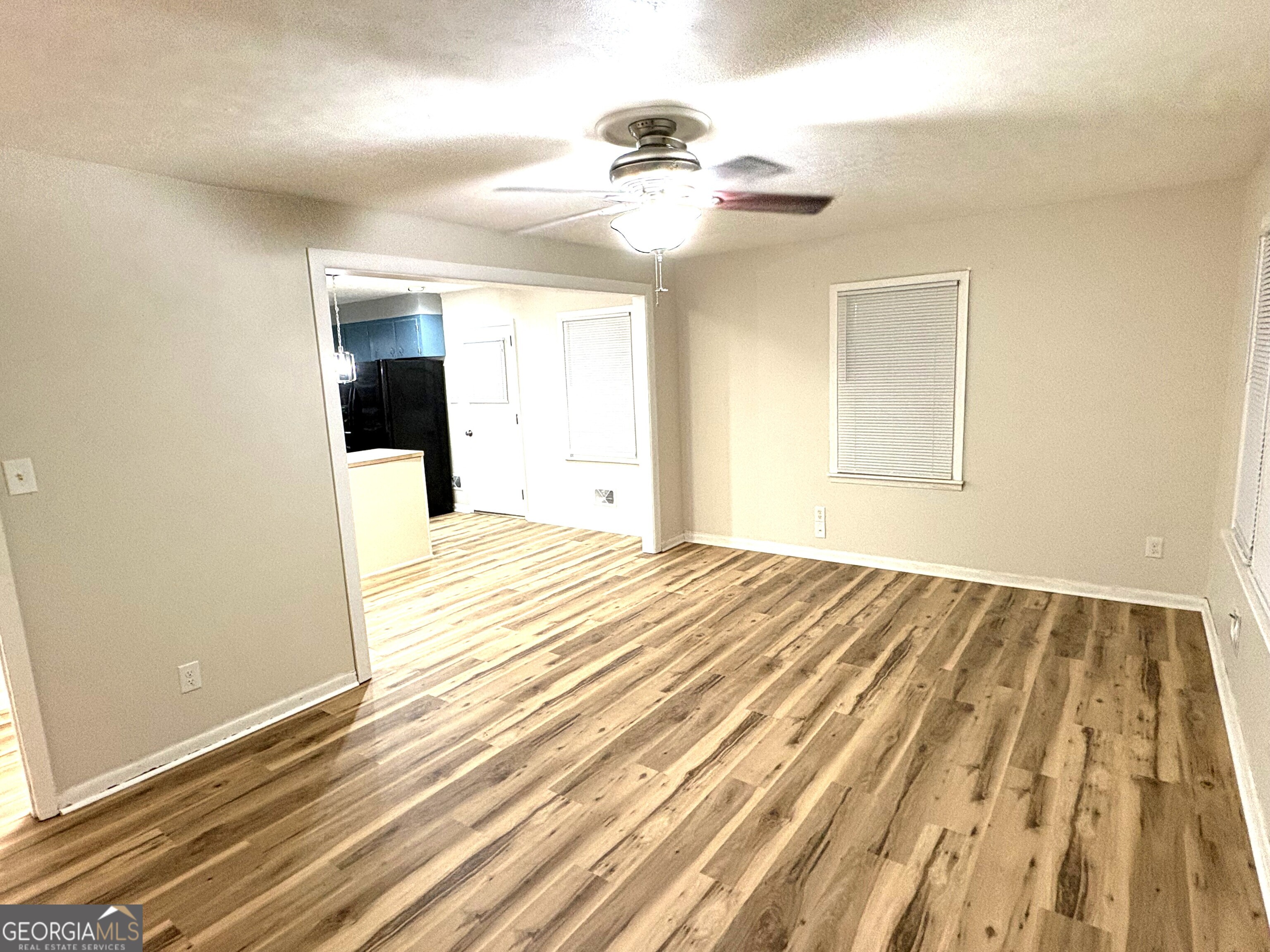 111 Hawthorne Road Warner Robins, GA 31093 - Photo 4 of 22 a view of a livingroom with wooden floor and a ceiling fan