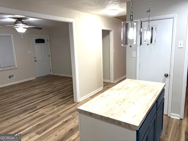 a kitchen with a sink stove and refrigerator