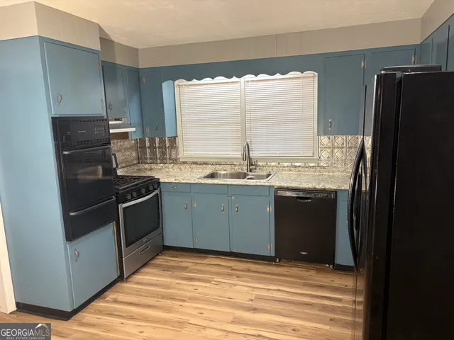 a bathroom with a sink double vanity and a mirror