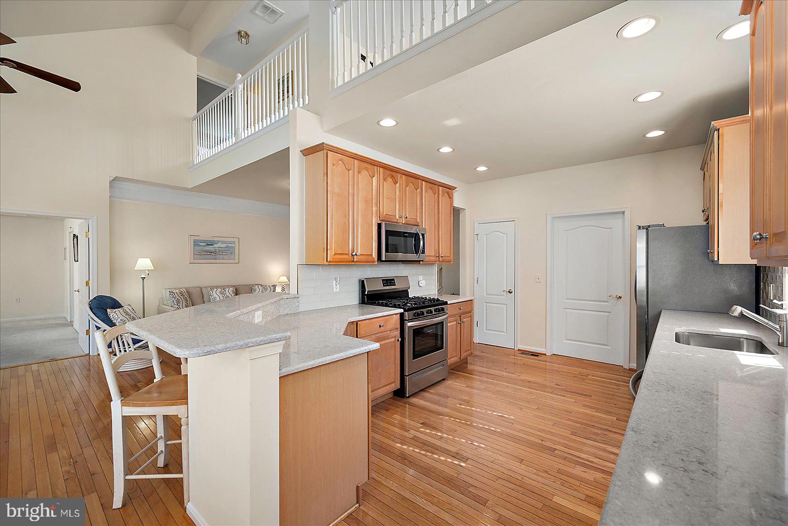 2 Audubon Circle Berlin, MD 21811 - Photo 12 of 71 a kitchen with stainless steel appliances granite countertop a sink stove and refrigerator