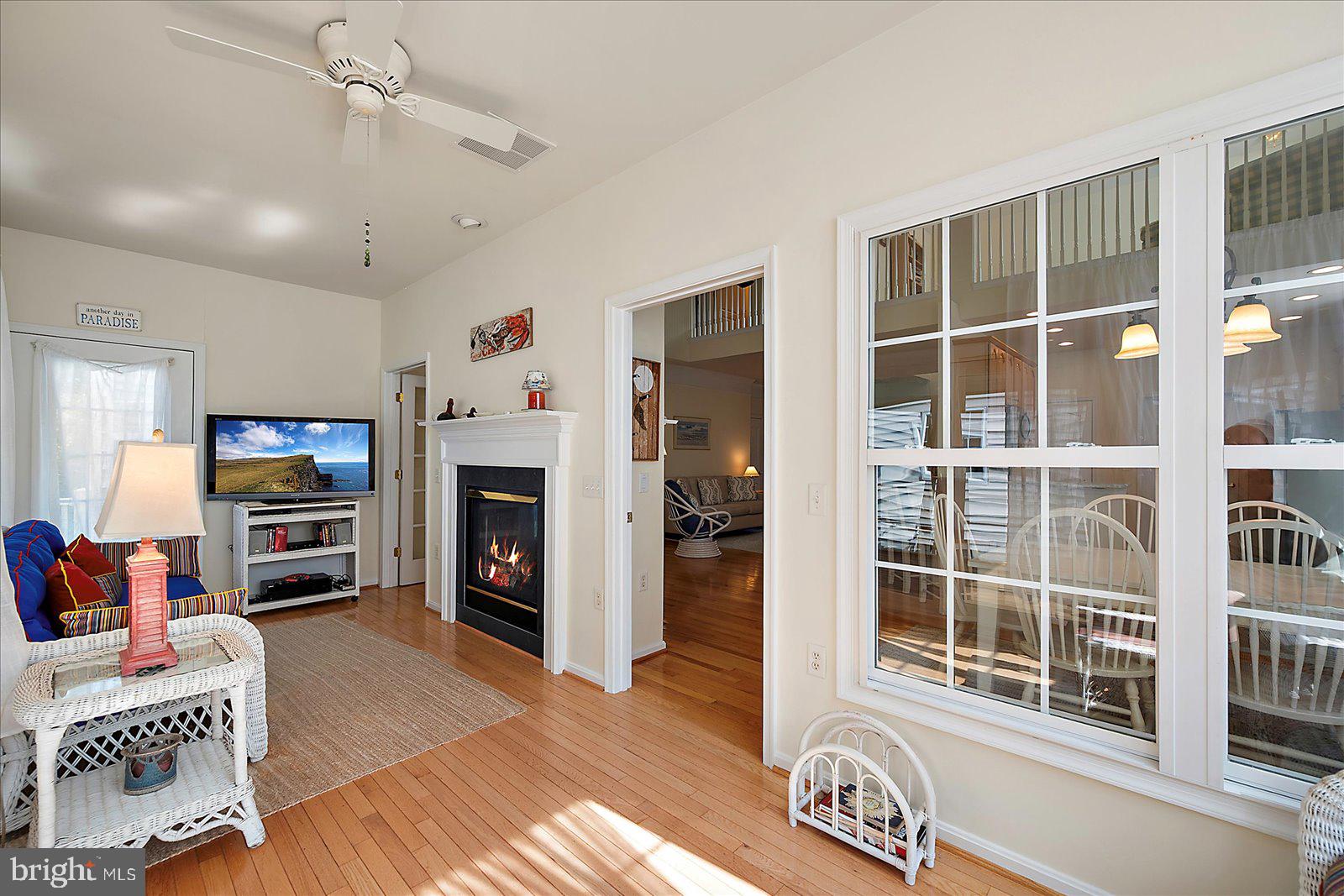 2 Audubon Circle Berlin, MD 21811 - Photo 20 of 71 a living room with furniture a fireplace and a flat screen tv