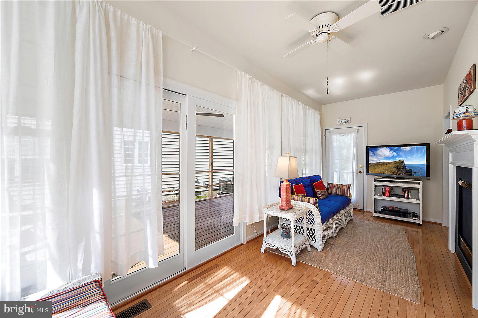 2 Audubon Circle Berlin, MD 21811 - Photo 21 of 71 a living room with furniture and a flat screen tv